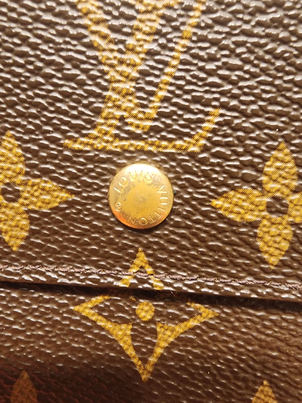vintage Louis Vuitton Monogram Elise Wallet crafted in the classic brown LV